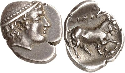 a close up of a coin with a head of a woman on it