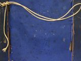 an old picture frame with a rope hanging from it ' s side