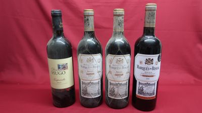 four bottles of wine are lined up on a red background
