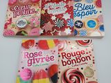 three books of pink, blue, and red candy