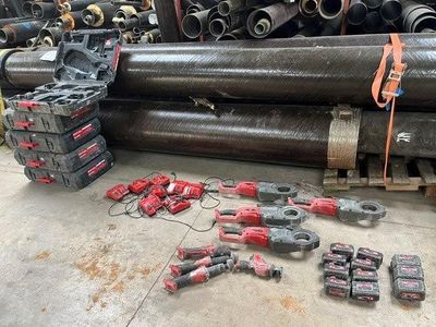 many different types of pipes and tools on the floor