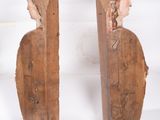 pair of carved wood sculptures of a woman and a man