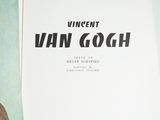 an open book with a picture of a man in a hat