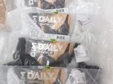 three packages of daily bras are wrapped in plastic bags