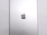an apple ipad sitting on top of a white table next to a white wall