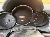 a close up of a car dashboard with various gauges