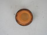 a brown plate on a white surface with a brown rim