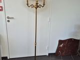 a lamp that is on a stand in a room
