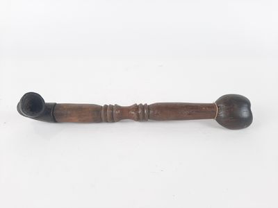 an old wooden pipe with a wooden handle on a white background