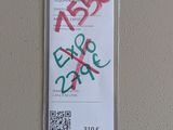 a sticker on the wall of a building with graffiti written on it