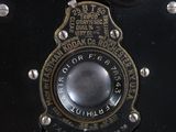 a close up of a black camera with a silver lens