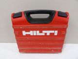 a red tool box with a black handle on a white table