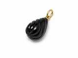 a close up of a black pendant on a white surface