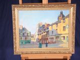 a painting of a street scene on a easel