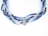 blue and white beaded necklace with a silver cross on it