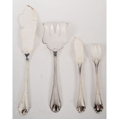 four pieces of silverware including a fork, knife, and spoon