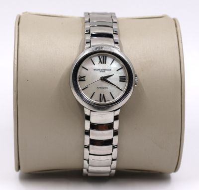 a close up of a wrist watch on a display case