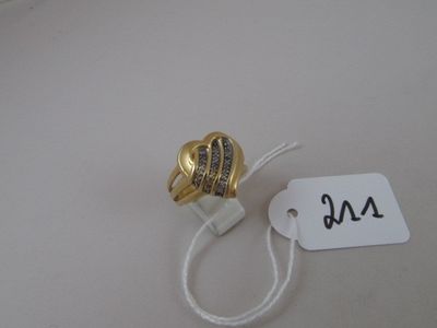 a gold heart shaped ring on a string with a price tag