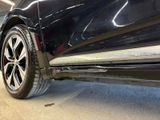 a close up of a car ' s rear end in a garage