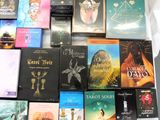 a lot of books that are sitting on a table