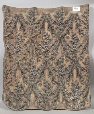 an old piece of cloth with a design on it