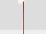a white floor lamp with a wooden base and a white shade