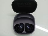 a pair of ear buds in a case on a table
