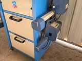 an image of a machine that is sitting in a garage