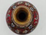 a vase with a red and blue design on it