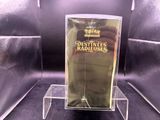 a glass display case with a bottle of perfume on it