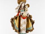 a statue of a woman holding a baby in her arms
