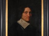 portrait d'un homme vêtu d'un manteau noir à col blanc