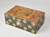 a small wooden box with a painting on it