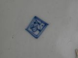 a white plate with a blue and white design on it
