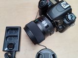 a camera that is sitting on a table next to a charger