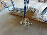 a pile of metal items on the floor in a warehouse