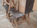 several pieces of wood are stacked on top of each other in a room