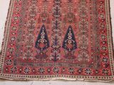 an old rug is laying on the floor in a room