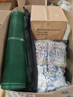 a cardboard box filled with assorted items in it