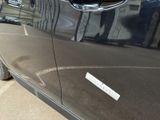 a close up of a car door with a sticker on it