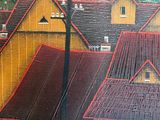 a picture of a painting of a town with a horse in the foreground