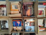 many boxes of books stacked on top of each other