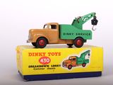 a toy truck that is sitting on top of a box