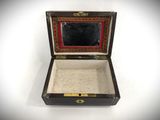 a small box with a mirror in it on a white surface