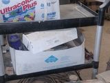 a cart that has many items on it in the room