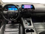the interior of a car with a steering wheel, dashboard, and dashboard controls