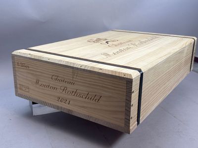 wooden wine box with engraved label on the side of it
