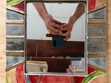 a person taking a picture of themselves in a mirror