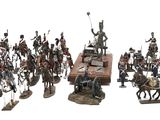 many figurines of different types and sizes on the table