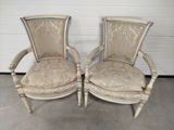 pair of antique french style chairs with upholstered cushions